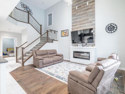 3608 46 Avenue, Beaumont, AB - Indoor Photo Showing Living Room With Fireplace