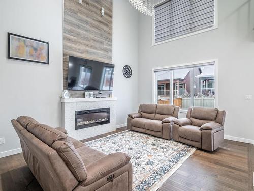 3608 46 Avenue, Beaumont, AB - Indoor Photo Showing Living Room With Fireplace