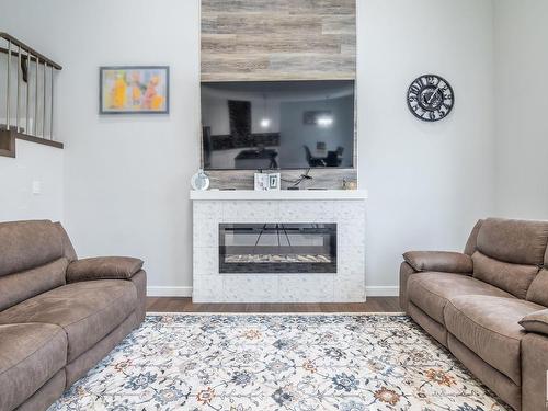 3608 46 Avenue, Beaumont, AB - Indoor Photo Showing Living Room With Fireplace