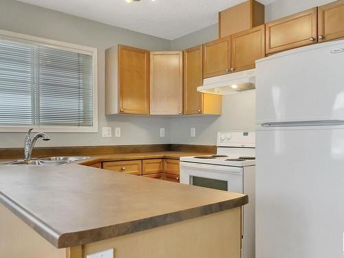 3 130 Hyndman Crescent, Edmonton, AB - Indoor Photo Showing Kitchen With Double Sink