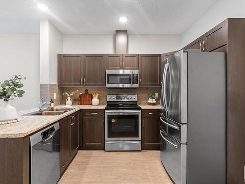 432 1818 Rutherford Road, Edmonton, AB - Indoor Photo Showing Kitchen With Double Sink