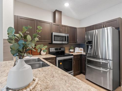 432 1818 Rutherford Road, Edmonton, AB - Indoor Photo Showing Kitchen With Double Sink With Upgraded Kitchen