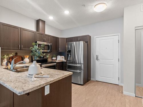 432 1818 Rutherford Road, Edmonton, AB - Indoor Photo Showing Kitchen With Upgraded Kitchen