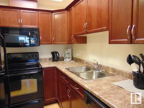 313 8702 Southfort Drive, Fort Saskatchewan, AB - Indoor Photo Showing Kitchen With Double Sink