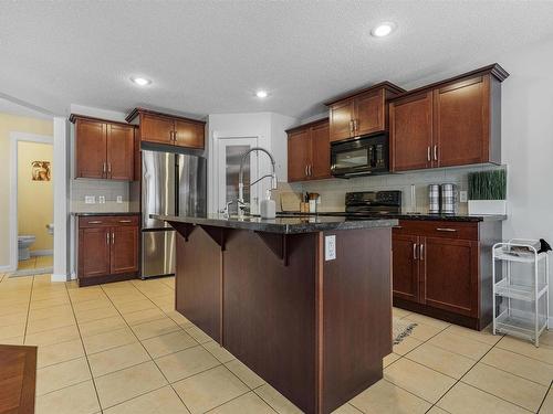 6155 11 Avenue, Edmonton, AB - Indoor Photo Showing Kitchen With Stainless Steel Kitchen