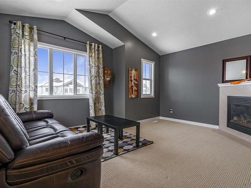 6155 11 Avenue, Edmonton, AB - Indoor Photo Showing Living Room With Fireplace