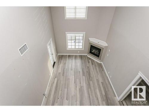 406 16235 51 Street, Edmonton, AB - Indoor Photo Showing Other Room With Fireplace