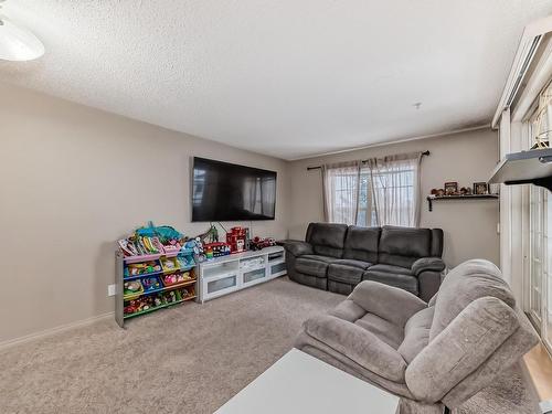 319- 11453 Ellerslie Rd Sw Road Sw, Edmonton, AB - Indoor Photo Showing Living Room