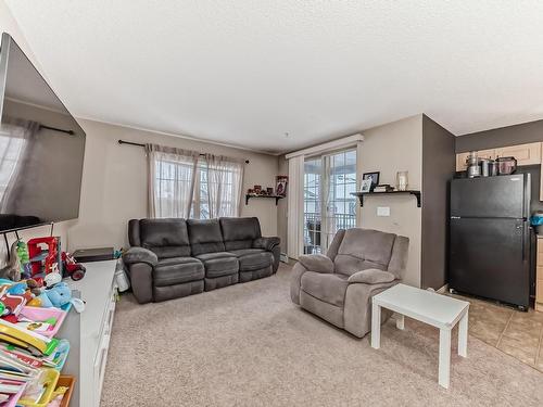 319- 11453 Ellerslie Rd Sw Road Sw, Edmonton, AB - Indoor Photo Showing Living Room