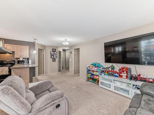 319- 11453 Ellerslie Rd Sw Road Sw, Edmonton, AB - Indoor Photo Showing Living Room