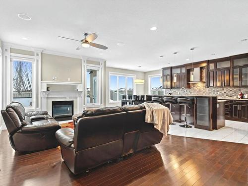 3948 Claxton Loop, Edmonton, AB - Indoor Photo Showing Living Room With Fireplace