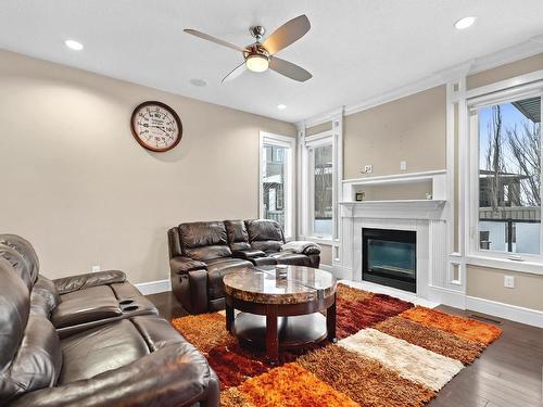 3948 Claxton Loop, Edmonton, AB - Indoor Photo Showing Living Room With Fireplace