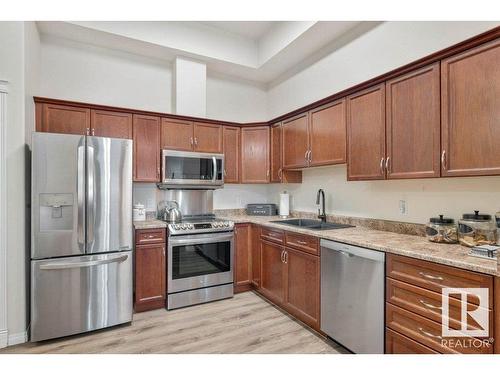 107 8702 Southfort Drive, Fort Saskatchewan, AB - Indoor Photo Showing Kitchen With Double Sink