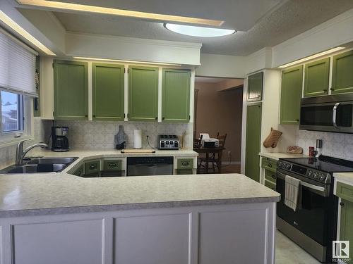 104 Hillside Court, Millet, AB - Indoor Photo Showing Kitchen With Double Sink With Upgraded Kitchen