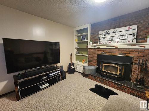 104 Hillside Court, Millet, AB - Indoor Photo Showing Living Room With Fireplace