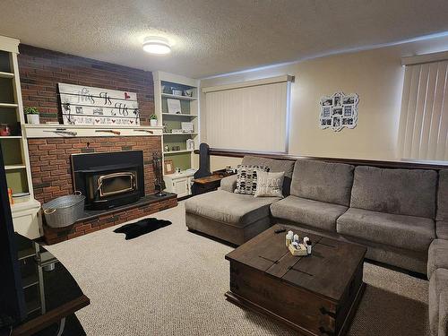 104 Hillside Court, Millet, AB - Indoor Photo Showing Living Room With Fireplace