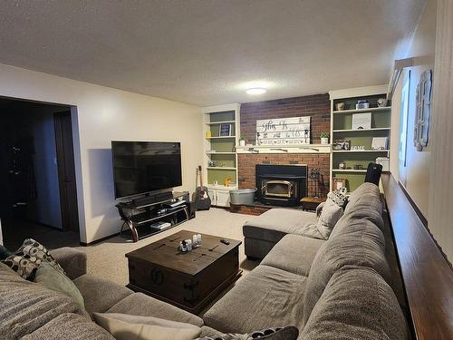 104 Hillside Court, Millet, AB - Indoor Photo Showing Living Room With Fireplace