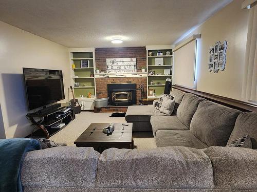 104 Hillside Court, Millet, AB - Indoor Photo Showing Living Room With Fireplace