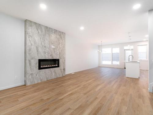 7325 Klapstein Crescent, Edmonton, AB - Indoor Photo Showing Living Room With Fireplace