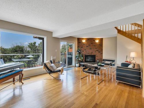 8212 Rowland Road, Edmonton, AB - Indoor Photo Showing Living Room With Fireplace