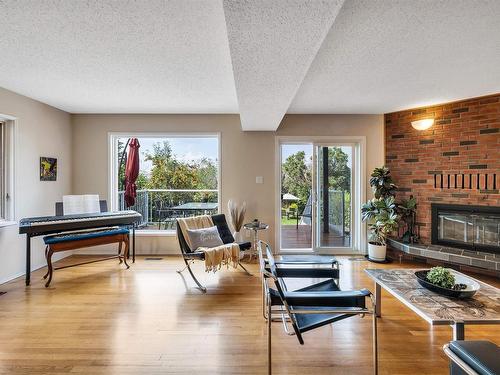 8212 Rowland Road, Edmonton, AB - Indoor Photo Showing Living Room With Fireplace