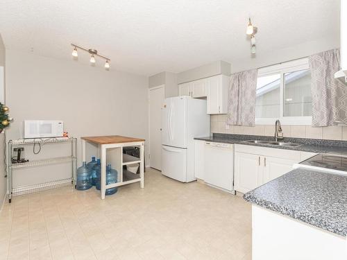 8715 27 Avenue, Edmonton, AB - Indoor Photo Showing Kitchen With Double Sink