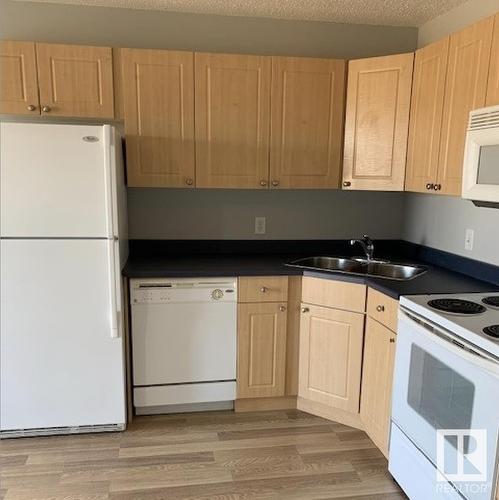 207 70 Woodsmere, Fort Saskatchewan, AB - Indoor Photo Showing Kitchen With Double Sink