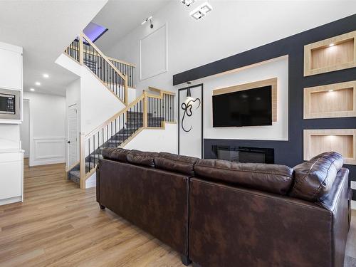 2920 1 Avenue, Edmonton, AB - Indoor Photo Showing Living Room With Fireplace