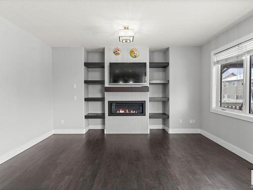 8719 218 Street, Edmonton, AB - Indoor Photo Showing Other Room With Fireplace