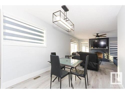 15828 98 Street, Edmonton, AB - Indoor Photo Showing Dining Room With Fireplace