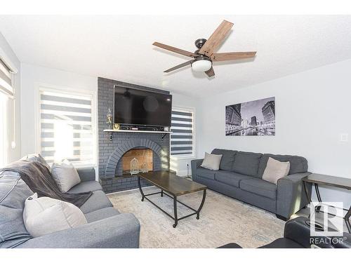 15828 98 Street, Edmonton, AB - Indoor Photo Showing Living Room With Fireplace