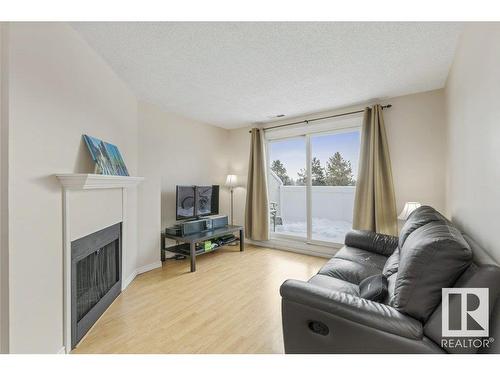 193 Lancaster Terrace, Edmonton, AB - Indoor Photo Showing Living Room With Fireplace