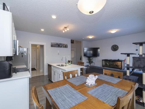 6 4835 Wright Drive, Edmonton, AB - Indoor Photo Showing Dining Room With Fireplace