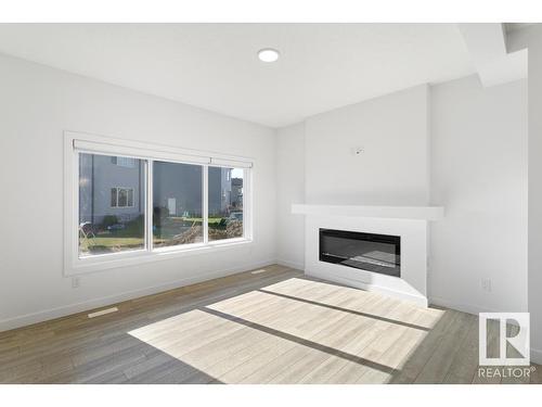 19007 20 Avenue, Edmonton, AB - Indoor Photo Showing Living Room With Fireplace