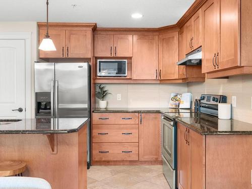 402 10142 111 Street Nw, Edmonton, AB - Indoor Photo Showing Kitchen With Stainless Steel Kitchen