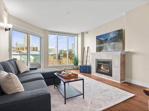 402 10142 111 Street Nw, Edmonton, AB - Indoor Photo Showing Living Room With Fireplace