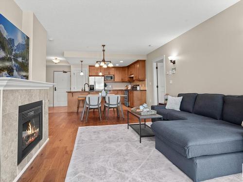 402 10142 111 Street Nw, Edmonton, AB - Indoor Photo Showing Living Room With Fireplace