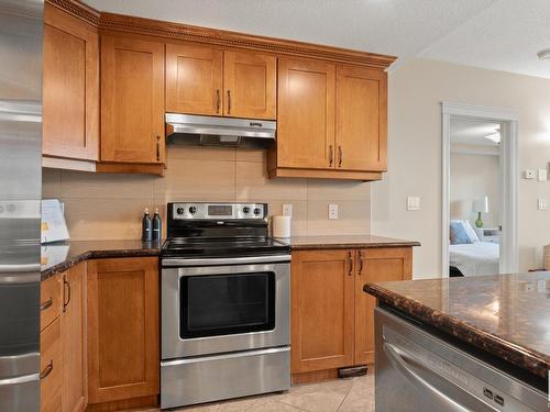 402 10142 111 Street Nw, Edmonton, AB - Indoor Photo Showing Kitchen With Stainless Steel Kitchen