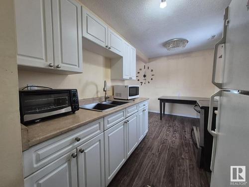 8273 29 Avenue Nw, Edmonton, AB - Indoor Photo Showing Kitchen With Double Sink