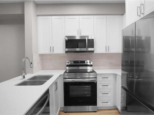 124 12804 140 Avenue, Edmonton, AB - Indoor Photo Showing Kitchen With Double Sink With Upgraded Kitchen