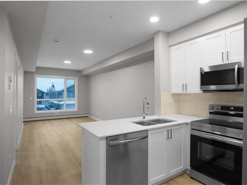 124 12804 140 Avenue, Edmonton, AB - Indoor Photo Showing Kitchen With Double Sink