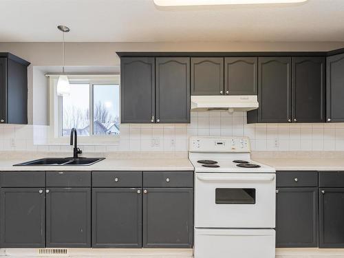 8709 99 Avenue, Morinville, AB - Indoor Photo Showing Kitchen With Double Sink