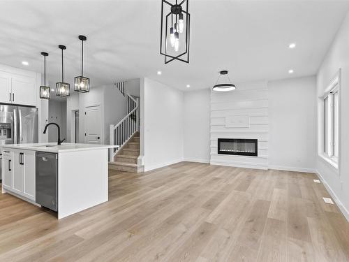 213 Kettyl Court, Leduc, AB - Indoor Photo Showing Other Room With Fireplace