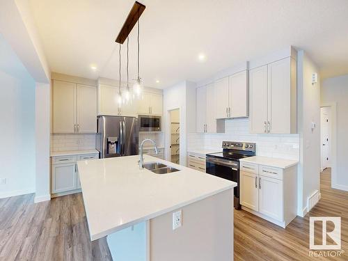 32 Rosewood Way, St. Albert, AB - Indoor Photo Showing Kitchen With Stainless Steel Kitchen With Double Sink With Upgraded Kitchen