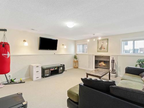 4022 37 Street, Edmonton, AB - Indoor Photo Showing Living Room With Fireplace