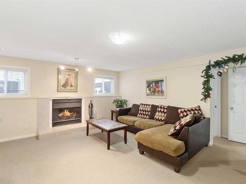 4022 37 Street, Edmonton, AB - Indoor Photo Showing Living Room With Fireplace