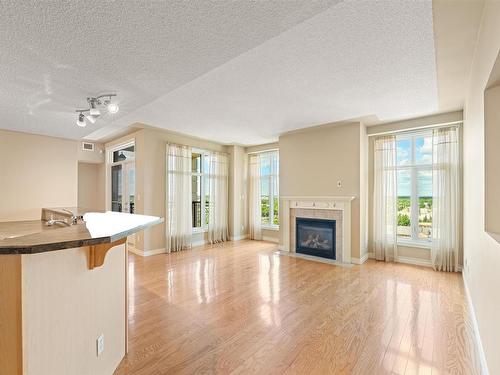 1401 9020 Jasper Avenue, Edmonton, AB - Indoor Photo Showing Living Room With Fireplace