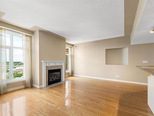 1401 9020 Jasper Avenue, Edmonton, AB - Indoor Photo Showing Living Room With Fireplace