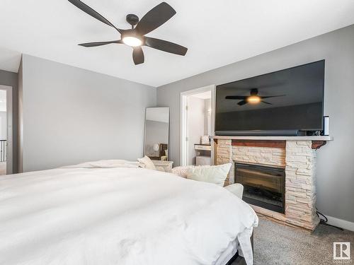 9402 85 Avenue, Morinville, AB - Indoor Photo Showing Bedroom With Fireplace