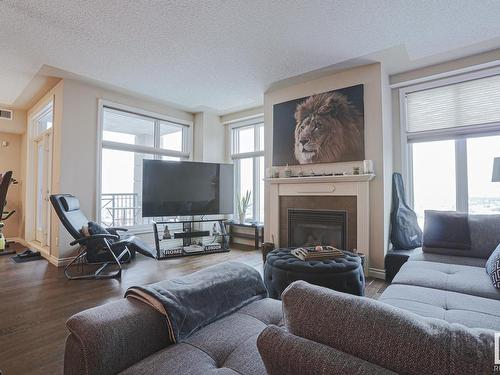 1201 9020 Jasper Avenue Nw, Edmonton, AB - Indoor Photo Showing Living Room With Fireplace